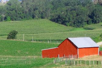 A farm surrounded by agriculture fields