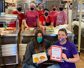 Food Service workers displaying a healthy lunch